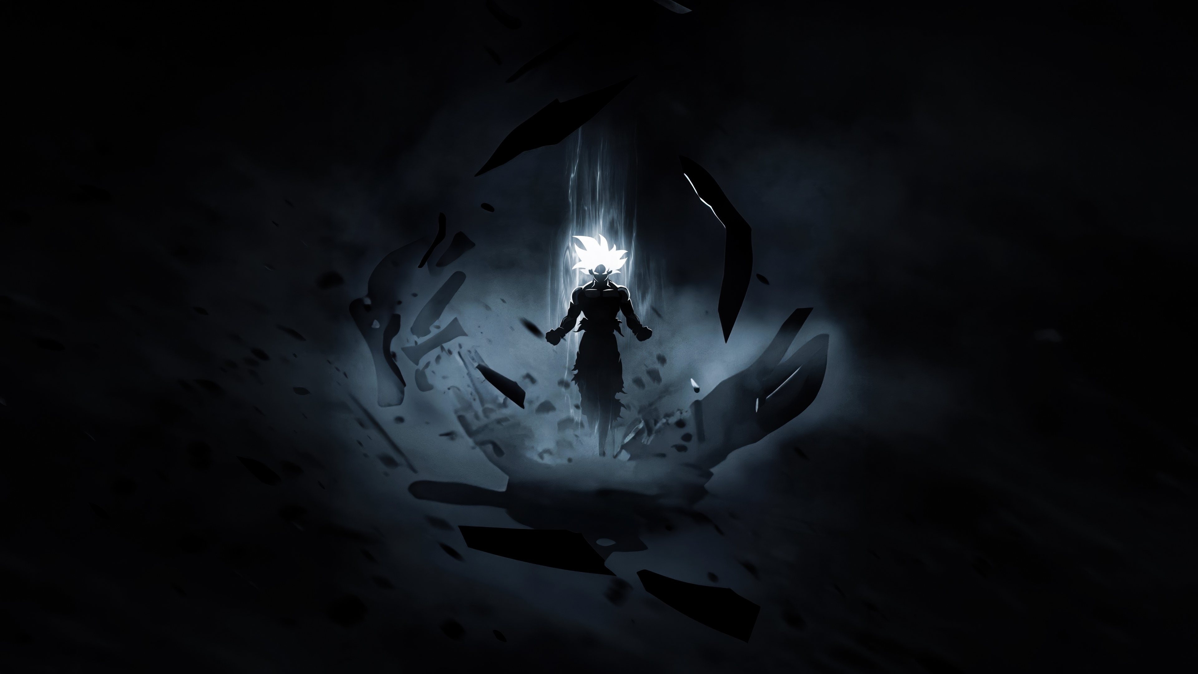 Goku, protagonista di Dragon Ball Super, nella sua forma potenziata dell’Ultra Istinto, avvolto da un’aura luminosa, su uno sfondo scuro.